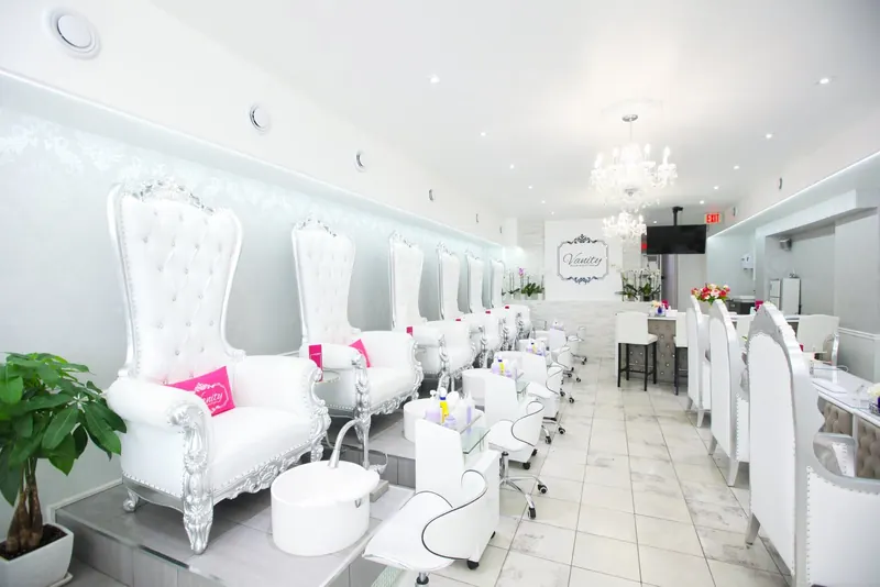 Pedicure area with plants and white thrones