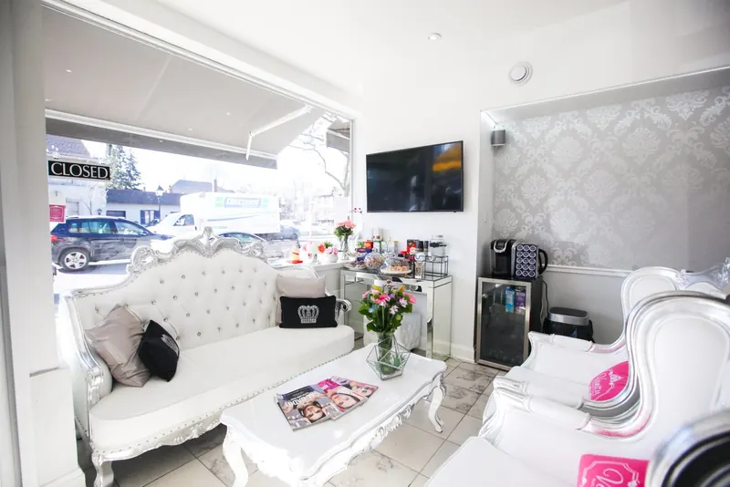 Reception lounge with white sofa and flowers